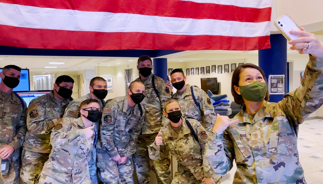 Chief Master Sgt. of the Air Force JoAnne S. Bass takes a selfie with members of the 316th Training Squadron at Goodfellow Air Force Base, Texas, Nov. 3, 2021. Bass observed how the 316th TRS operated after moving its unclassified training curriculum to an online format, and how that promotes student-driven education.