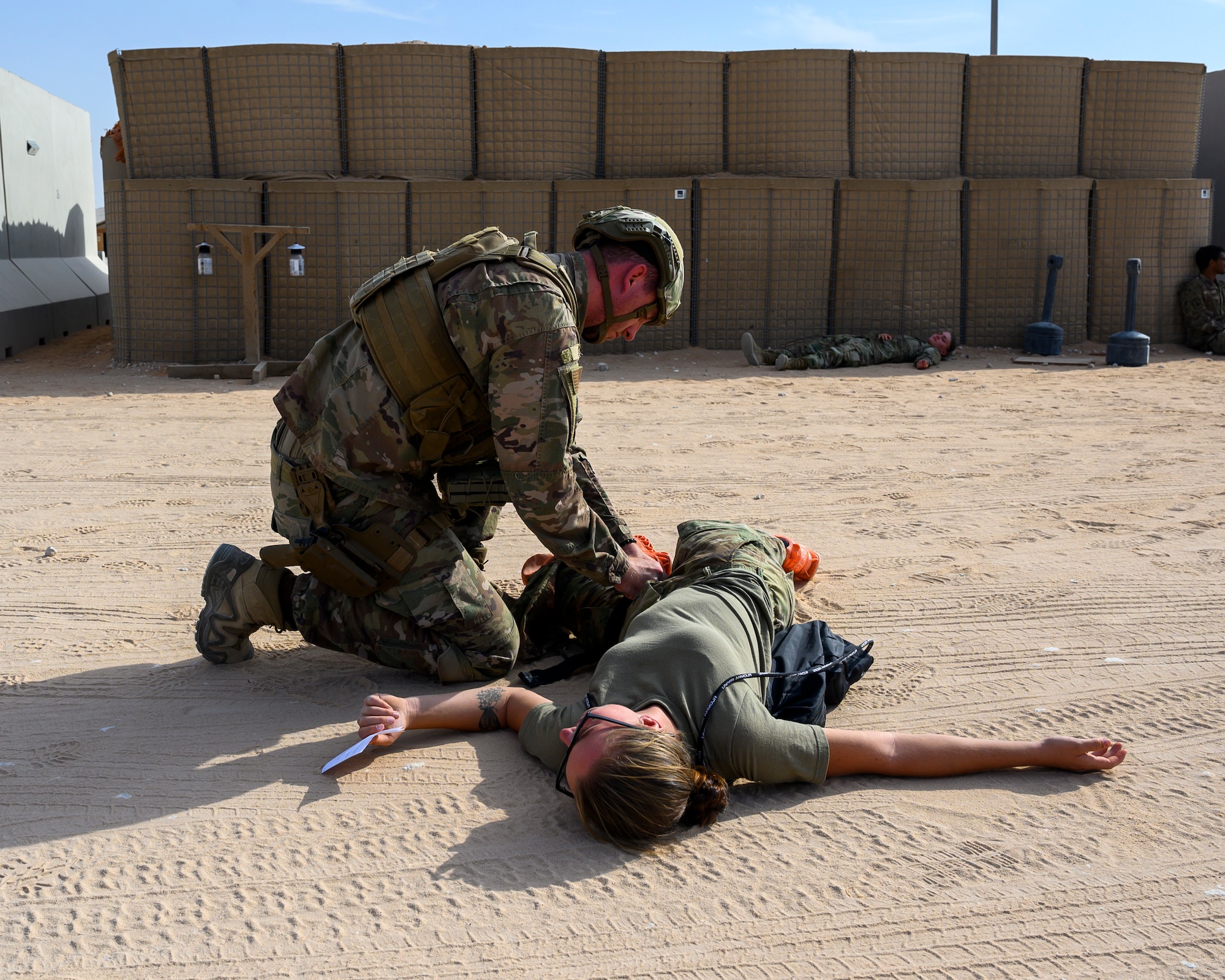 A 378th Expeditionary Security Forces Squadron member responds to simulated victim during a mass casualty and missile defense exercise at Prince Sultan Air Base, Kingdom of Saudi Arabia, Oct. 28 2021.