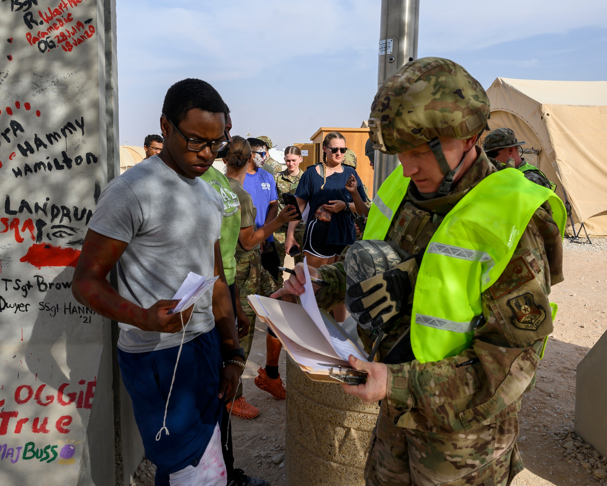 U.S. Air Force Maj. Ren Bedell, 378th Expeditionary Medical Group public health officer, conducts triage assessments on simulated patients during a mass casualty and missile defense exercise at Prince Sultan Air Base, Kingdom of Saudi Arabia, Oct. 28 2021.