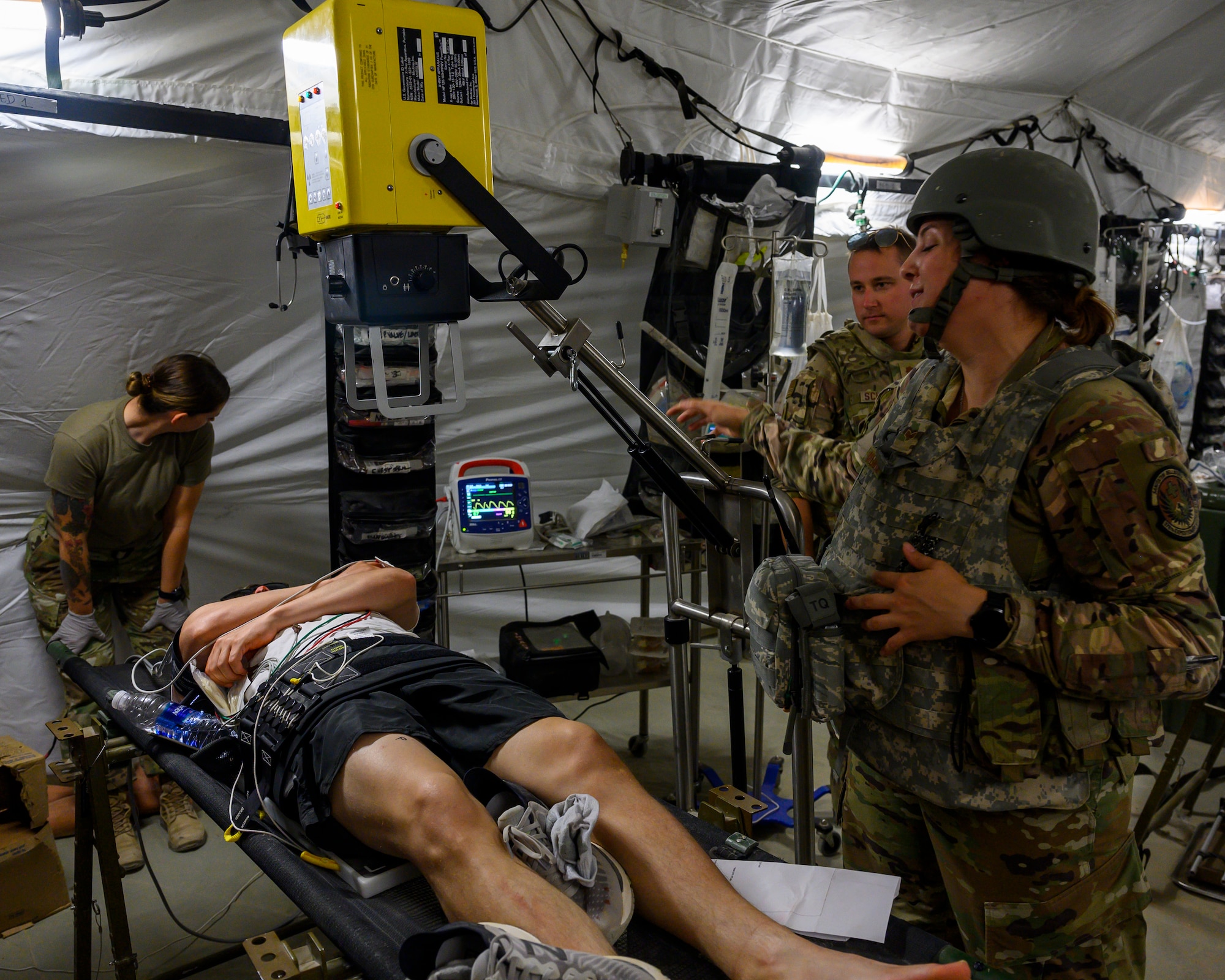378th Expeditionary Medical Group personnel administer treatment to a simulated victim during a mass casualty and missile defense exercise at Prince Sultan Air Base, Kingdom of Saudi Arabia, Oct. 28 2021.