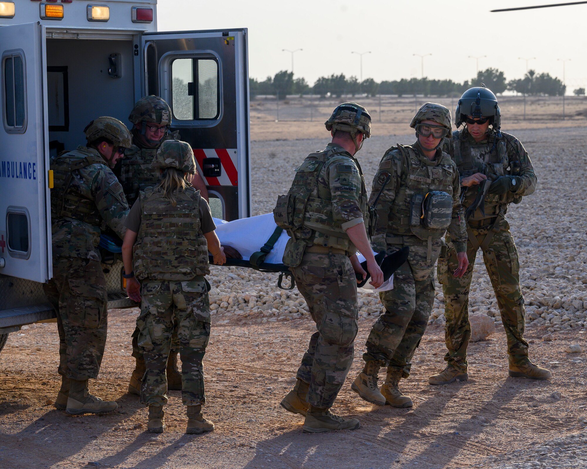 Members of the 378th Expeditionary Medical Group transport a mock victim to a medical evacuation helicopter during mass casualty and missile defense exercise at Prince Sultan Air Base, Kingdom of Saudi Arabia, Oct. 28 2021.