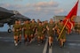 U.S. Marine LtCol Andrew D’Ambrogi, the commanding officer of Marine Fighter Attack Squadron 211, leads The Wake Island Avengers, Royal Navy Sailors and Royal Marines during a motivational 2.11 mile, 246th Birthday run on the flight deck of HMS Queen Elizabeth in the Gulf of Aden on November 10, 2021. VMFA-211 has been deployed as part of the United Kingdom’s Carrier Strike Group 21. The success of this deployment demonstrates that the United States and the UK are united in our efforts to ensure security and freedom of the seas, that our maritime power projection capabilities are interoperable, complementary, and global.