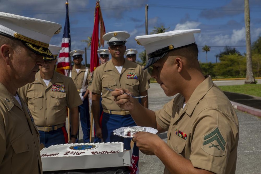 U.S. Marine Corps Cpl. Jorge Aguilar, a network administrator assigned to Marine Corps Base Camp Blaz, eats a piece of cake during a cake cutting ceremony held on Naval Communications Telecommunications Station Guam, Nov. 10, 2021. MCB Camp Blaz held the ceremony to honor the Marine Corps 246th birthday. During the formal cake cutting ceremony, a piece of cake is given to the oldest Marine present, who then passes it to the youngest Marine present, signifying the passing of knowledge, traditions and responsibilities between the two generations.