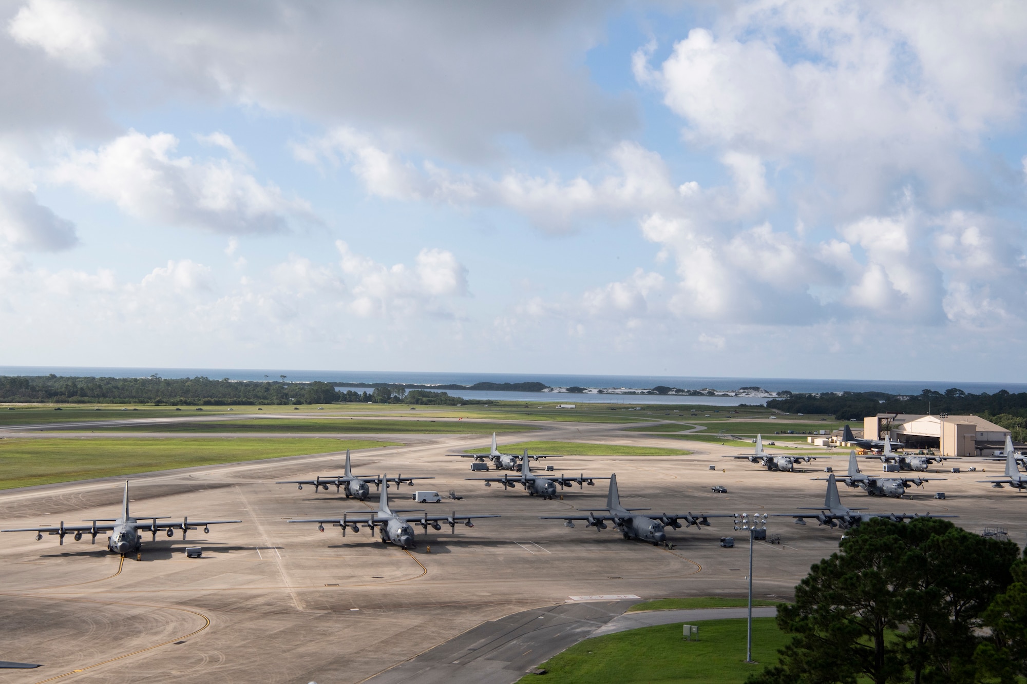 A portion of Hurlburt Field’s C-130 fleet rests on the flightline at Hurlburt Field, Florida, July 22, 2021. Air Force Special Operations Command (AFSOC) uses several specialized C-130s to accomplish their mission, but they’re all maintained by the 1st Special Operations Maintenance Squadron. (U.S. Air Force photo by Staff Sgt. Janiqua P. Robinson)