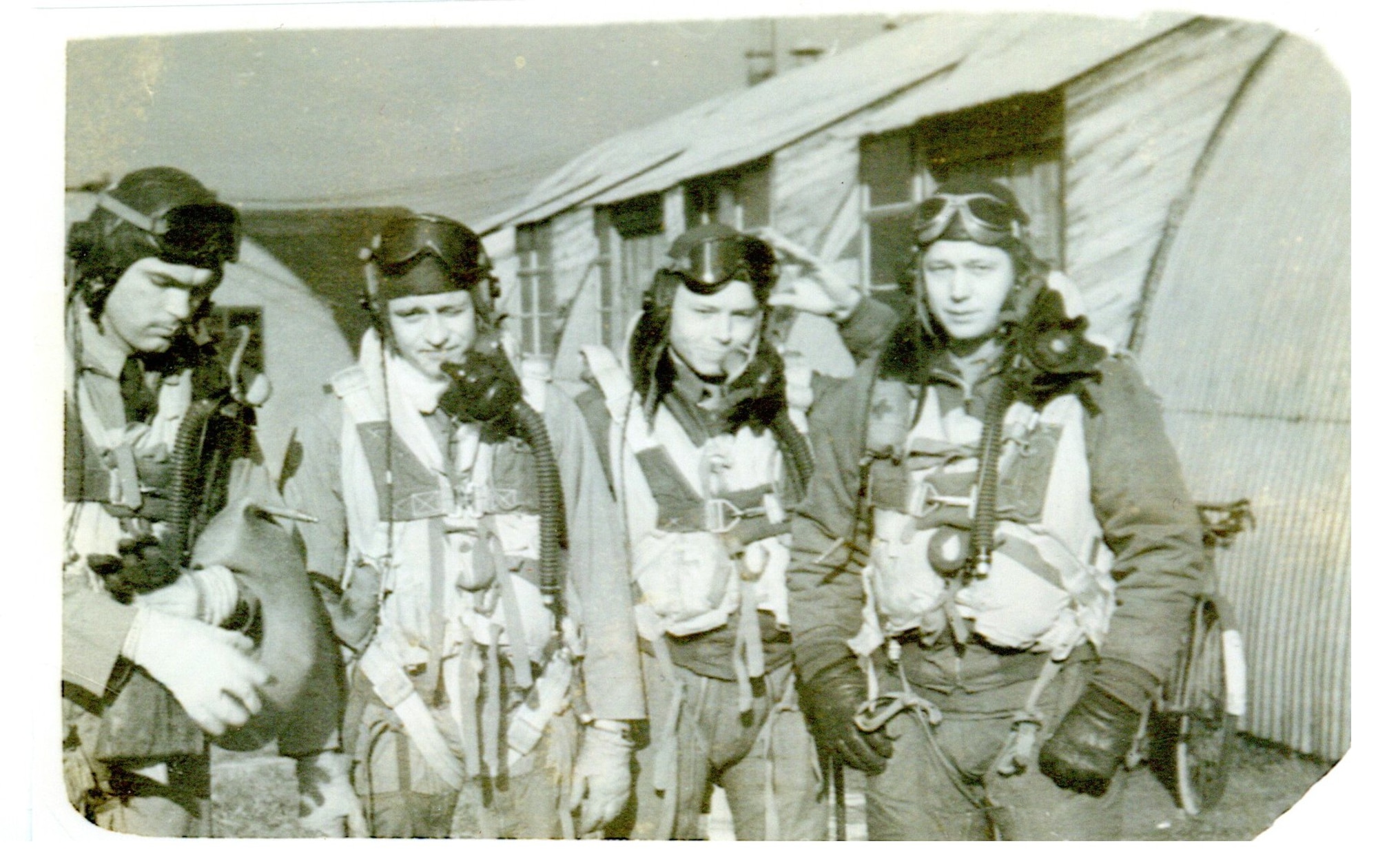 Group of four pilots pose for a photo.