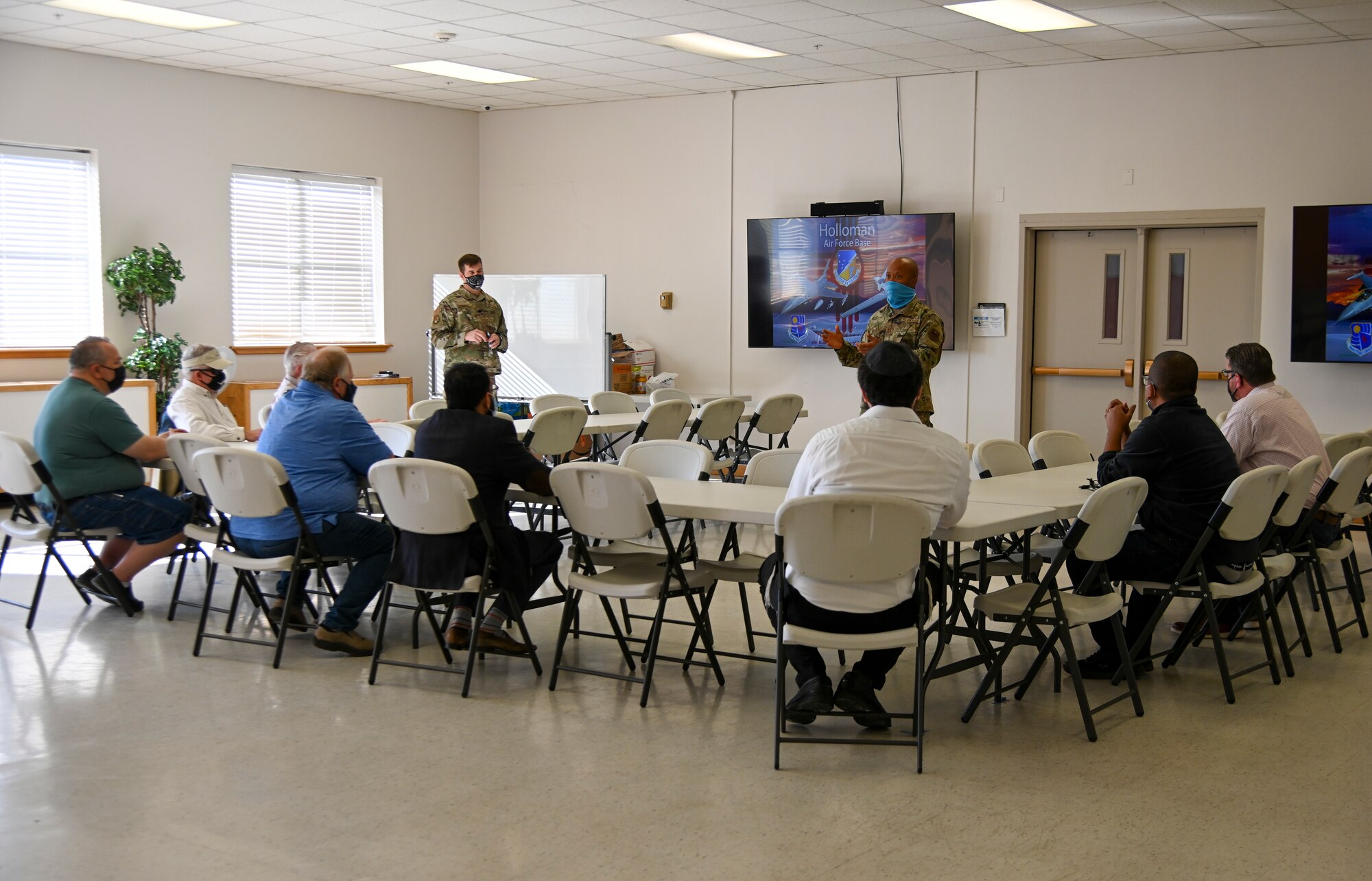 Capt. Charles Ugo, 49th Wing chaplain, welcomes local clergy to a Clergy Day event, Nov. 4, 2021, on Holloman Air Force Base, New Mexico. Clergy Day is an annual event the Holloman AFB Chaplain Corps hosts to forge rapport and relationships with local clergy of all faith backgrounds who support the Holloman community. (U.S. Air Force photo by Airman 1st Class Jessica Sanchez-Chen)