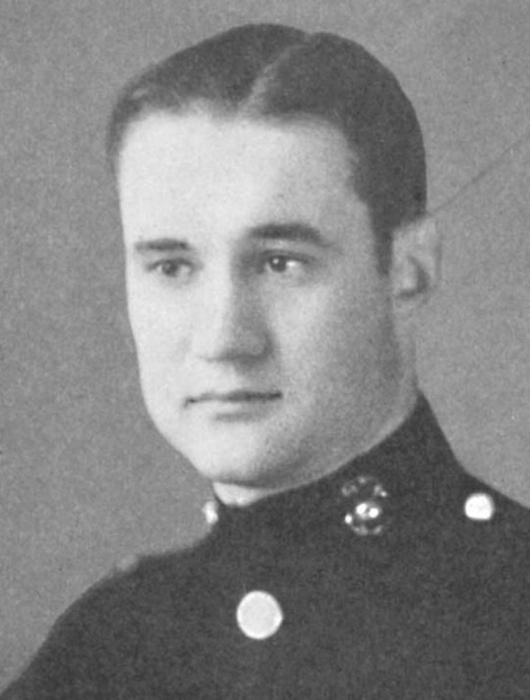 A man in uniform poses for a photo.