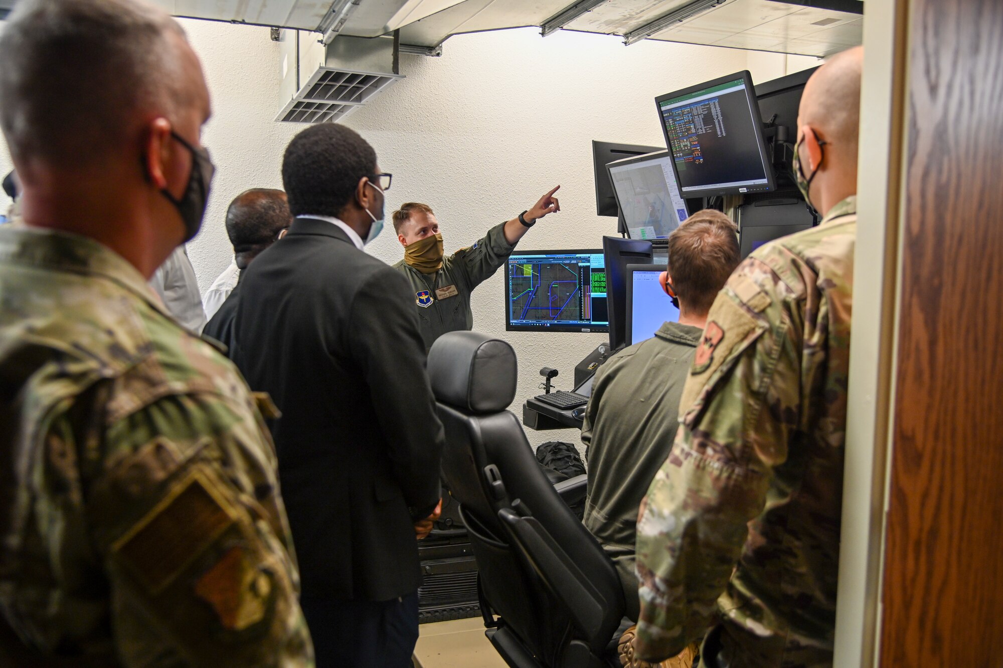 Capt. Michael Shields, 9th Attack Squadron MQ-9 instructor pilot, demonstrates an MQ-9 Reaper simulator to local clergy members during Clergy Day, Nov. 4, 2021, on Holloman Air Force Base, New Mexico. Local clergy members were given a tour of the 16th Training Squadron MQ-9 simulator to see Holloman’s capabilities and Airmen and Guardians in action. (U.S. Air Force photo by Airman 1st Class Jessica Sanchez-Chen)