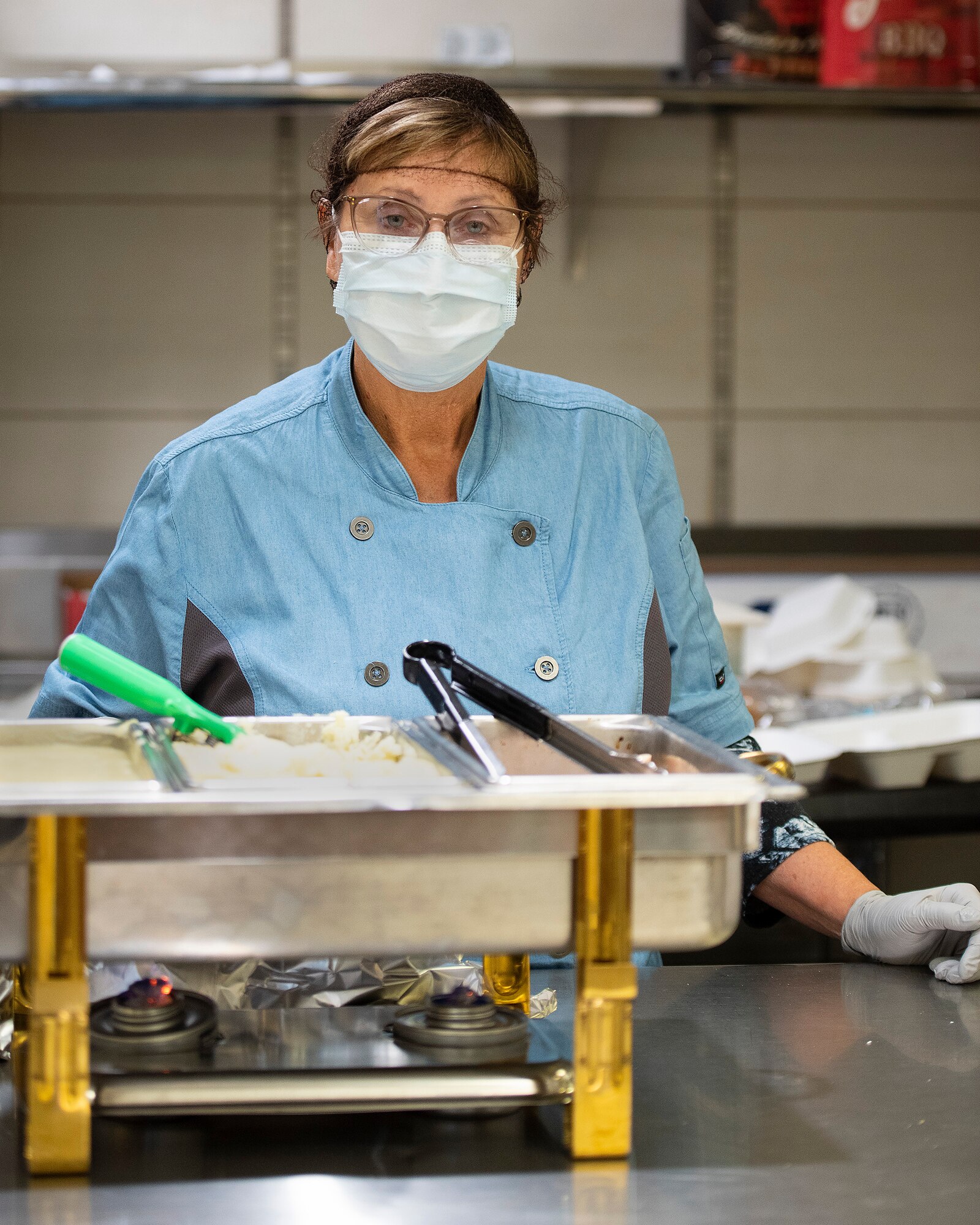 Ruth Ward, 88th Medical Group, prepares and serves food Nov. 5, 2021, in the Wright-Patterson Medical Center, Wright-Patterson Air Force Base, Ohio. (U.S. Air Force photo by R.J. Oriez)