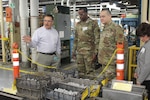 Three men (two military) and one woman view items at  the Jenkintown, Pennsylvania facility.