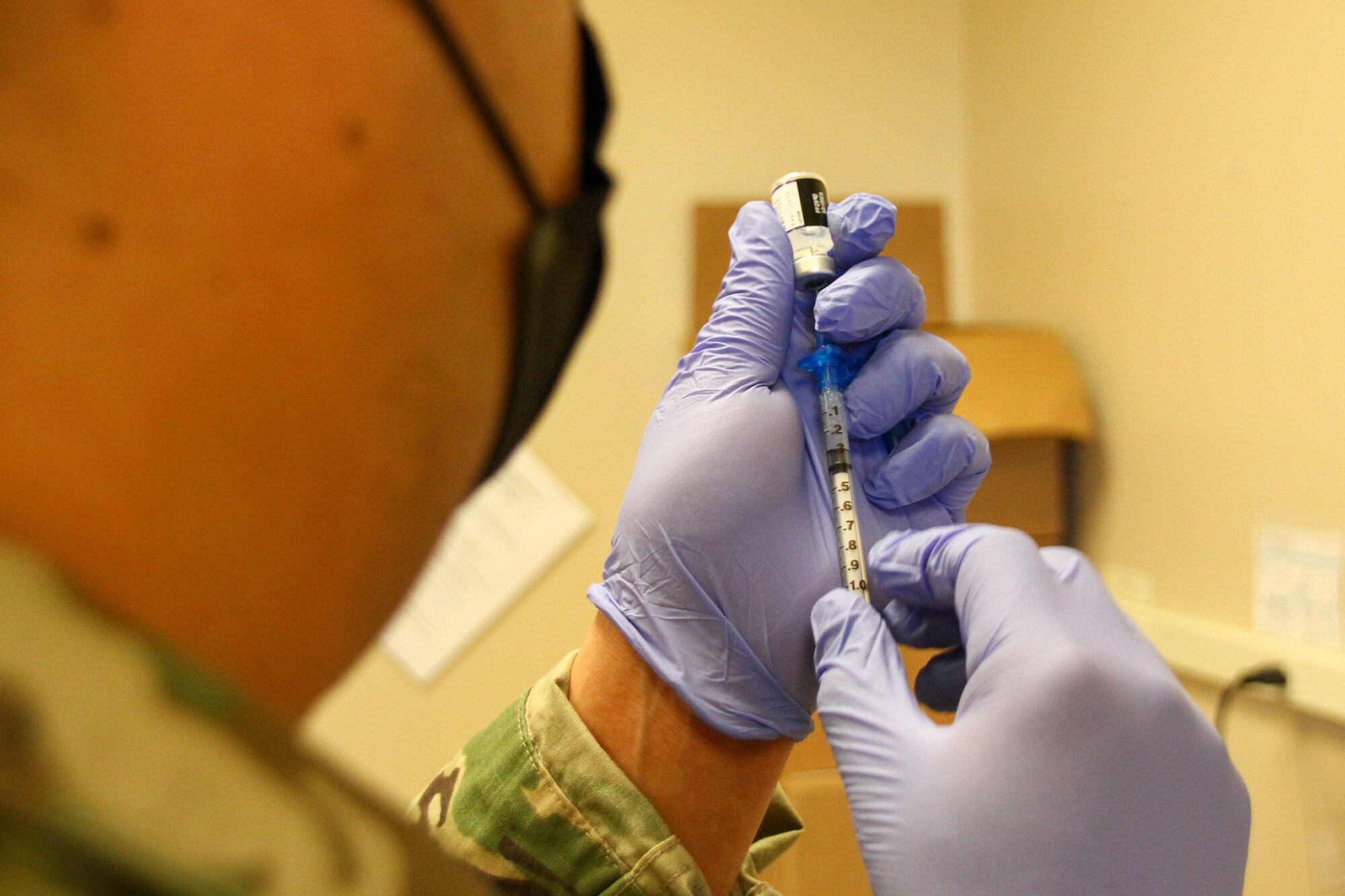 Kentucky Army National Guard Sgt. Roberto Gorostieta, a combat medic with the 130th Engineer Support Company and vaccination team non-commissioned officer, draws a COVID-19 vaccination at the Boone National Guard Center, in Frankfort, Ky., November 6, 2021. Soldiers and airmen received the vaccine as part of Operation Fortified Guardian for the Kentucky National Guard. (Kentucky Army National Guard photo by Sgt. Matt Damon)