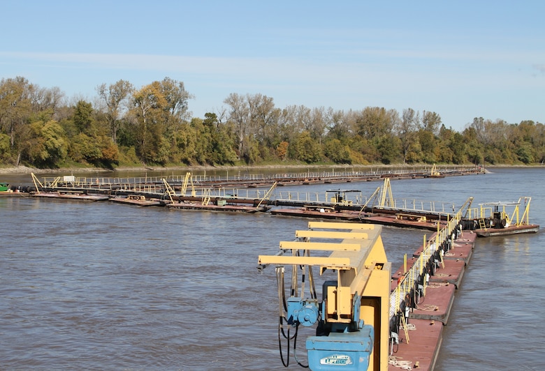 The tail of the Dredge Goetz carries the floating pipe that discharges the debris agitated from the dredging activities to the down river shipping channel where it washes away with the flow of water.
