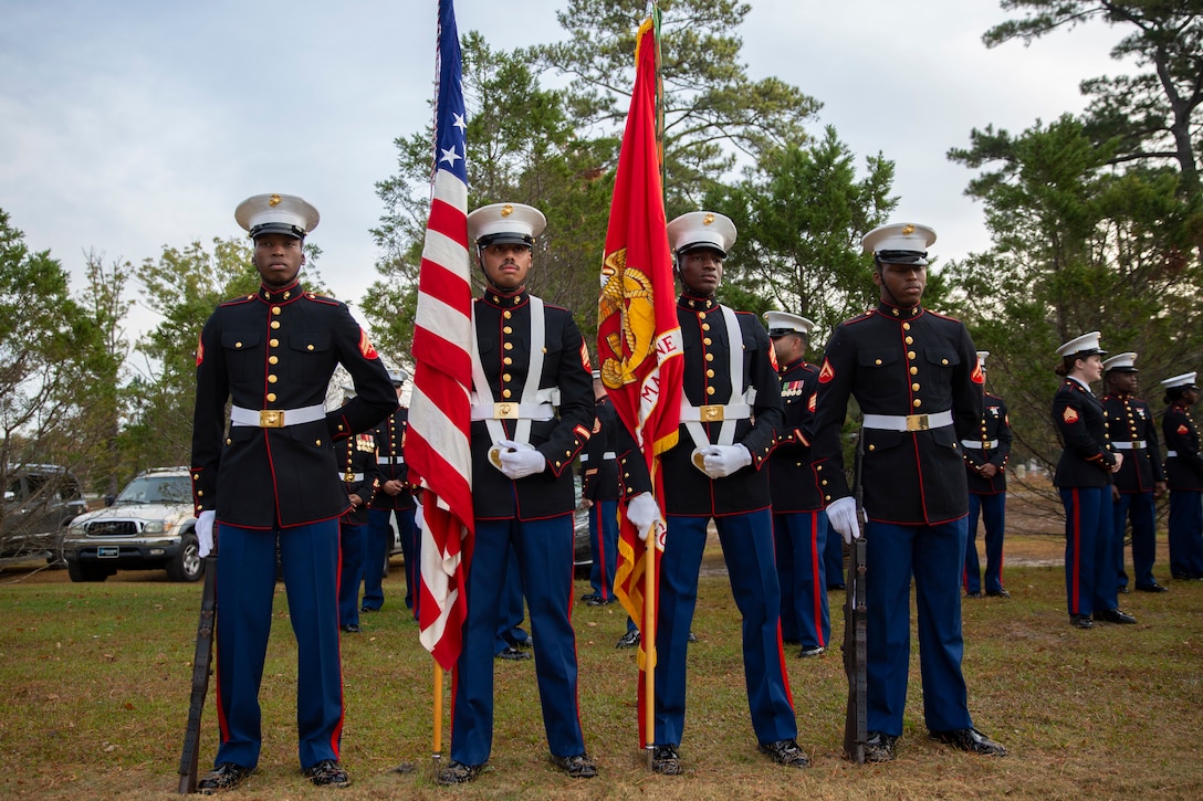 U.S. Marines with Headquarters and Support Battalion, Marine Corps Installations East-Marine Corps Base Camp Lejeune, stand in a color guard formation during a wreath laying ceremony honoring Sgt. Maj. Thomas J. McHugh, thrid sergeant major of the Marine Corps, at the Coastal Carolina State Veterans Cemetery, in Jacksonville, North Carolina, Nov. 10, 2021. The annual wreath-laying ceremony has been held since 2007 to memorialize the commandants and sergeants major of the past in conjunction with the Marine Corps Birthday. (U.S. Marine Corps photo by Lance Cpl. Alexis Sanchez)