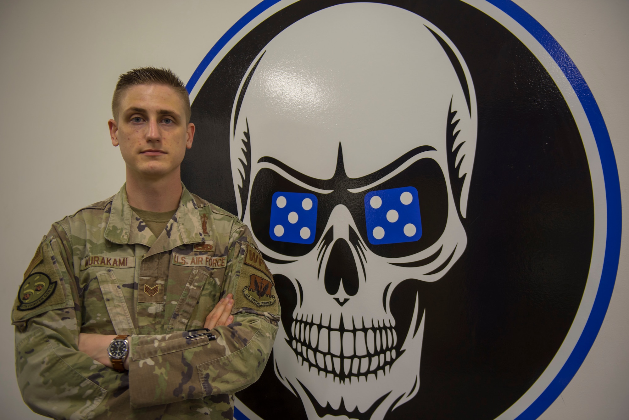 An Airman is photographed as part of Weasel of the Week.