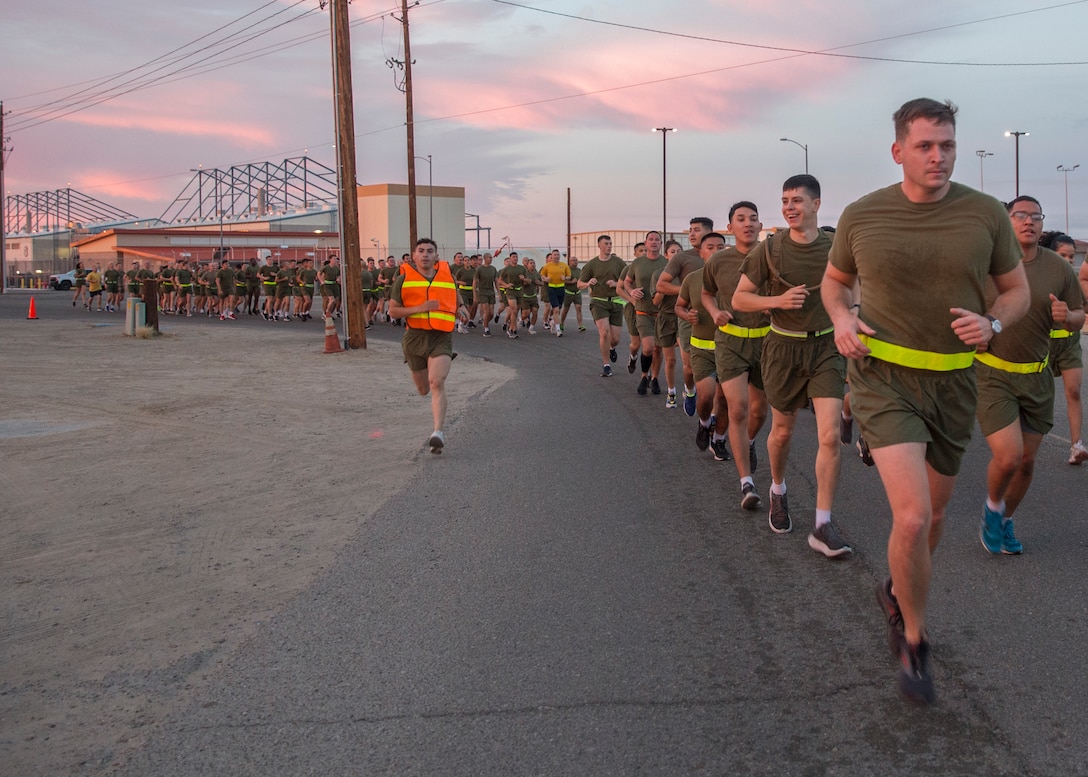 U.S. Marines with Headquarters and Headquarters Squadron (H&HS) participate in a unit run at Marine Corps Air Station Yuma, Ariz., Nov. 9, 2021. The run was in celebration of the 246th Marine Corps birthday and was intended to strengthen esprit de corps and camaraderie amongst Marines and Sailors of H&HS. (U.S. Marine Corps photo by Sgt. Jason Monty)