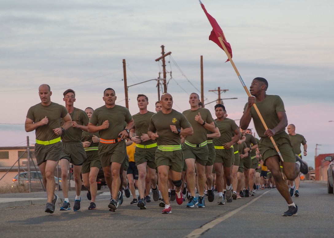 U.S. Marines with Headquarters and Headquarters Squadron (H&HS) participate in a unit run at Marine Corps Air Station Yuma, Ariz., Nov. 9, 2021. The run was in celebration of the 246th Marine Corps birthday and was intended to strengthen esprit de corps and camaraderie amongst Marines and Sailors of H&HS. (U.S. Marine Corps photo by Sgt. Jason Monty)