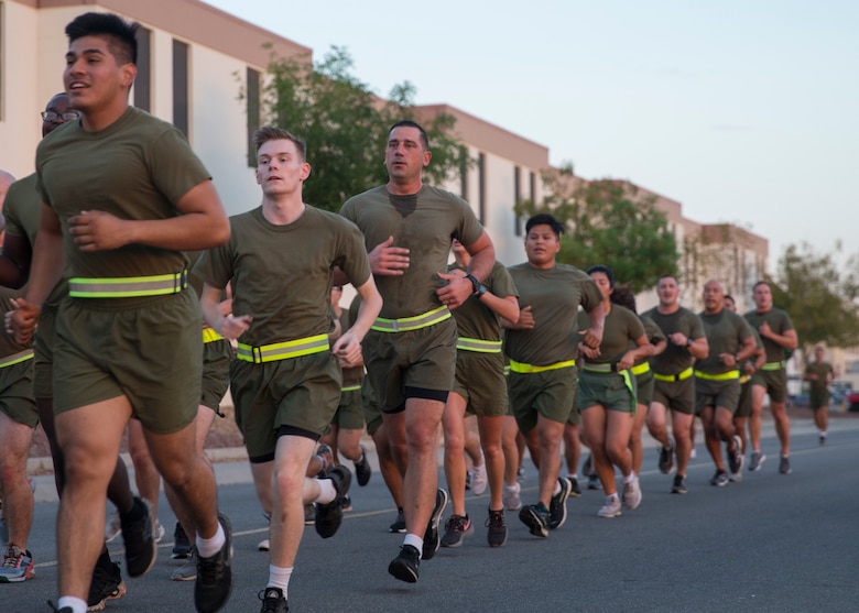 U.S. Marines with Headquarters and Headquarters Squadron (H&HS) participate in a unit run at Marine Corps Air Station Yuma, Ariz., Nov. 9, 2021. The run was in celebration of the 246th Marine Corps birthday and was intended to strengthen esprit de corps and camaraderie amongst Marines and Sailors of H&HS. (U.S. Marine Corps photo by Sgt. Jason Monty)