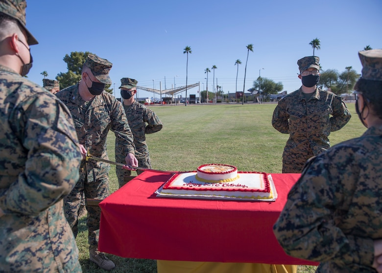 U.S. Marine Corps Col. Charles E. Dudik, the Marine Corps Air Station (MCAS) Yuma Commanding Officer, cuts a cake during a ceremony celebrating the Marine Corps’ 246th birthday at MCAS Yuma, Ariz., Nov. 10, 2021. The annual ceremony signified the passing of traditions from one generation to the next. (U.S. Marine Corps photo by Sgt. Jason Monty)