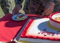 U.S. Marines at Marine Corps Air Station (MCAS) Yuma conduct a ceremony celebrating the Marine Corps’ 246th birthday at MCAS Yuma, Ariz., Nov. 10, 2021. The annual ceremony signified the passing of traditions from one generation to the next. (U.S. Marine Corps photo by Sgt. Jason Monty)