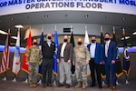 Military and civilian leaders gather to discuss protect and defend missions.