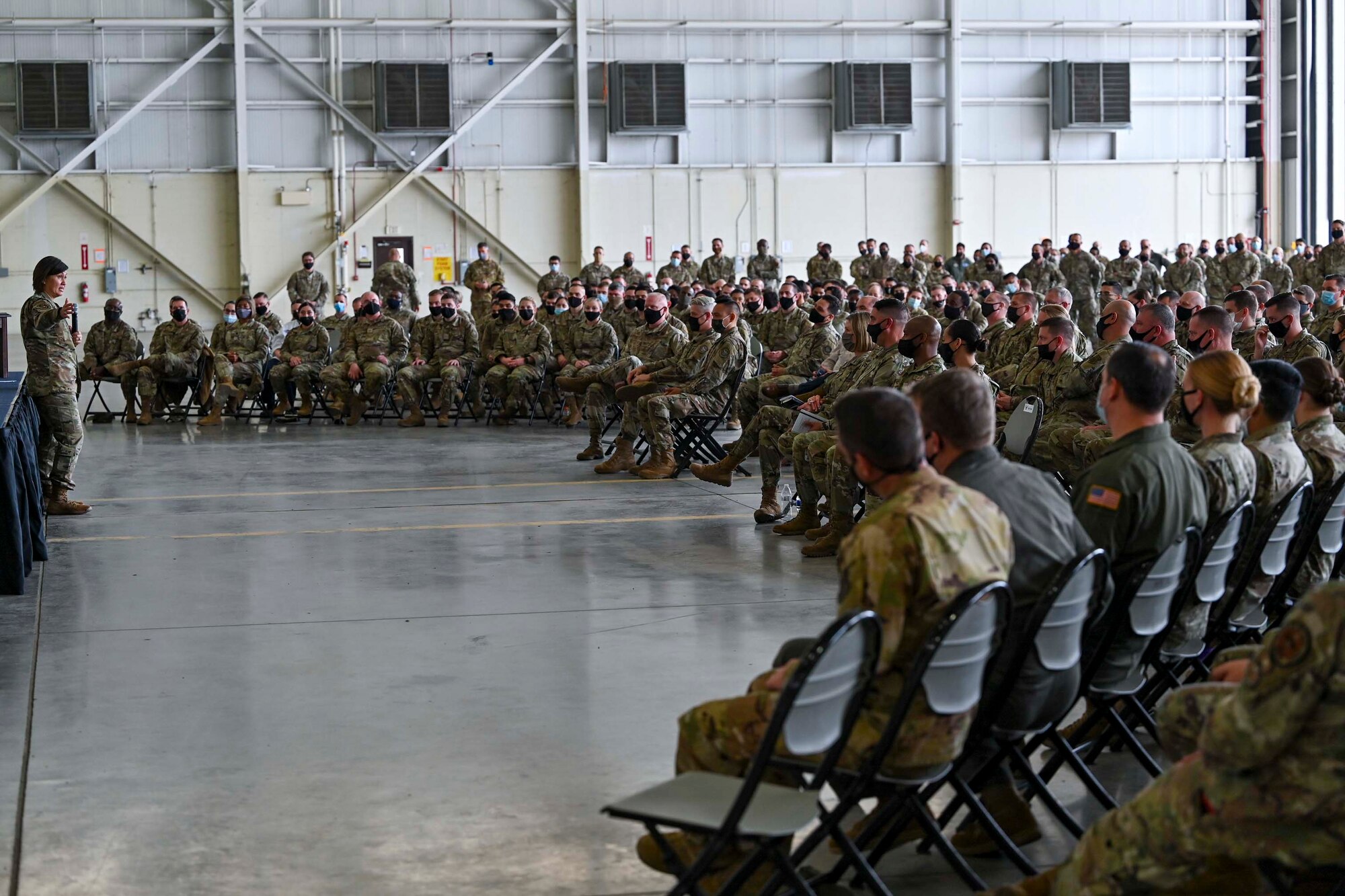 A person speaks to an audience