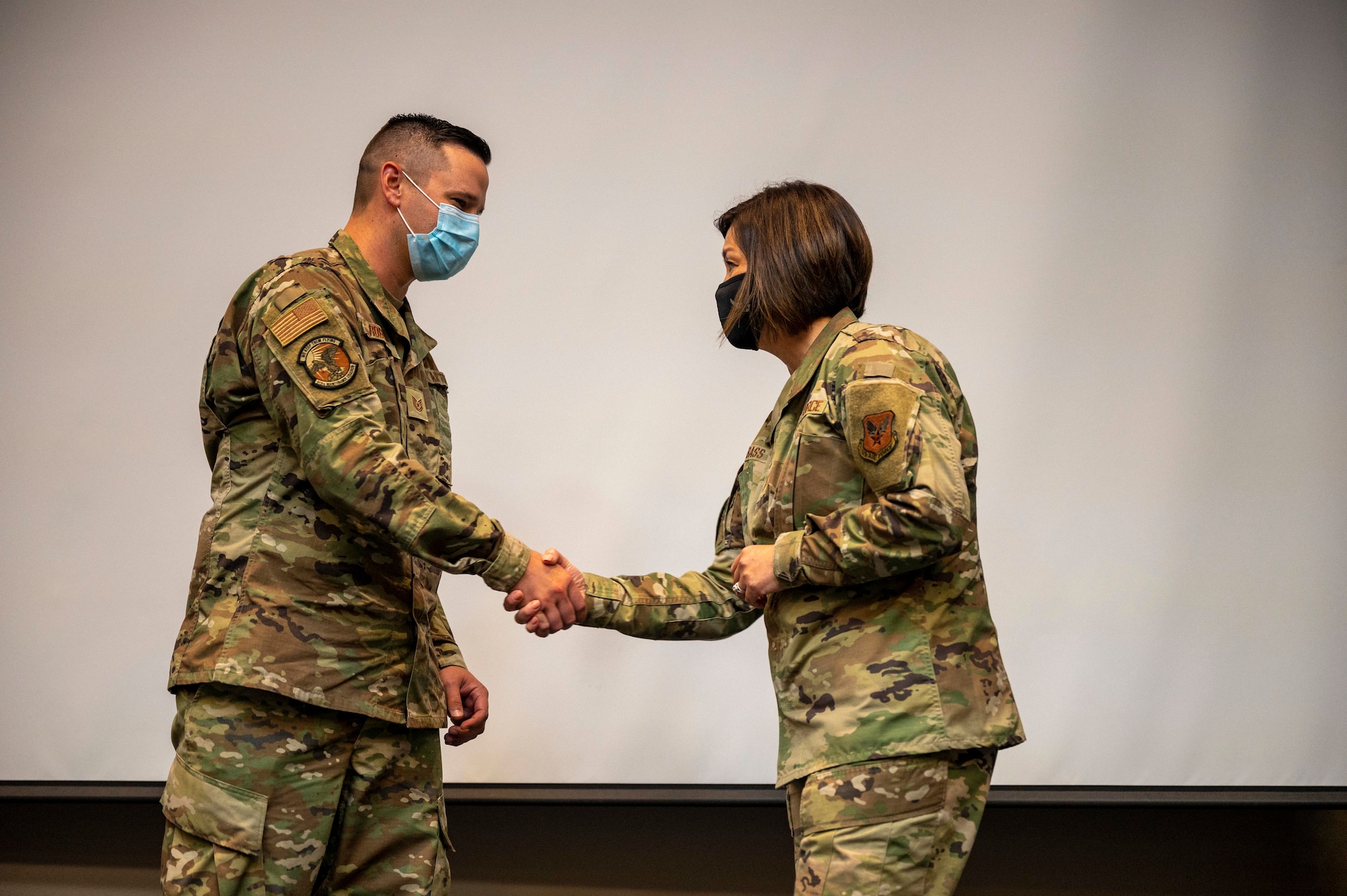 Two people shake hands