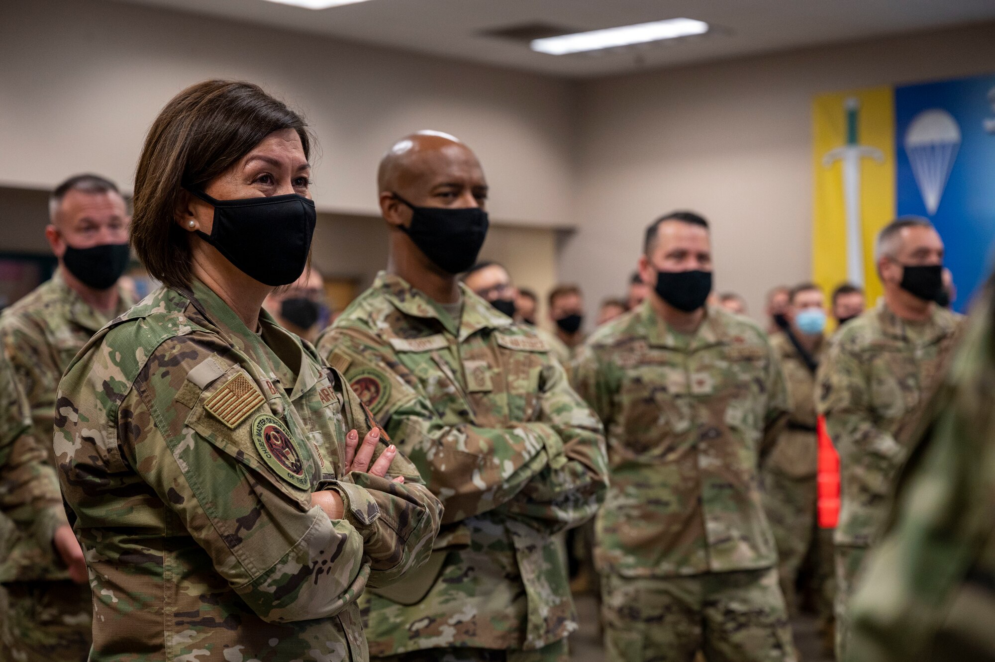 People listen to a briefing