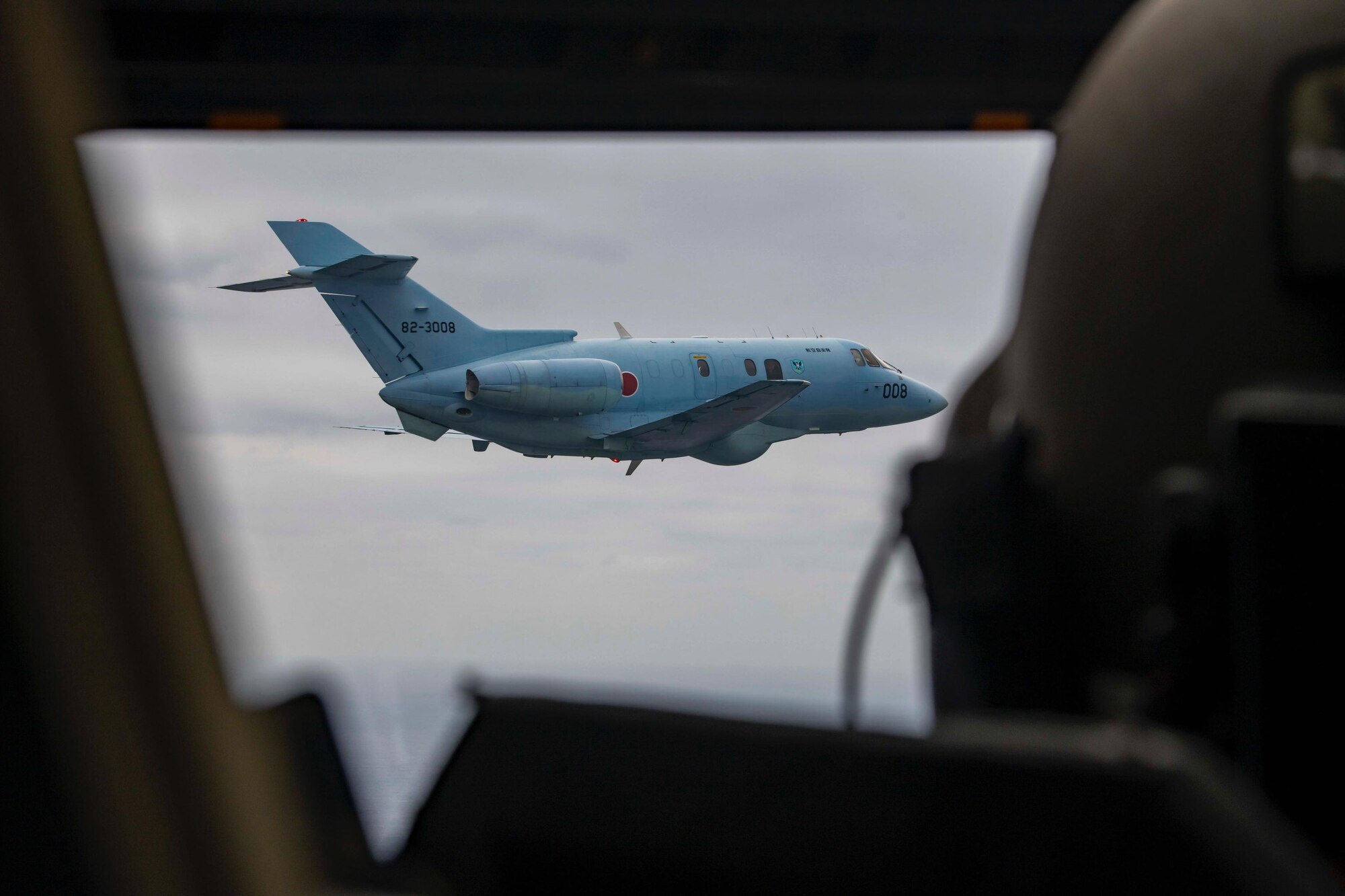 A Japanese Air Self Defense Force U-125A assigned to Naha Air Rescue Wing flies alongside a CV-22 Osprey assigned to the 353rd Special Operations Wing on Nov 9, 2021 during a search and rescue exercise. The purpose of this training is to enhance the Japan-U.S. bilateral response capabilities to real-world emergencies. (U.S. Air Force Photo by A1C Moses Taylor)