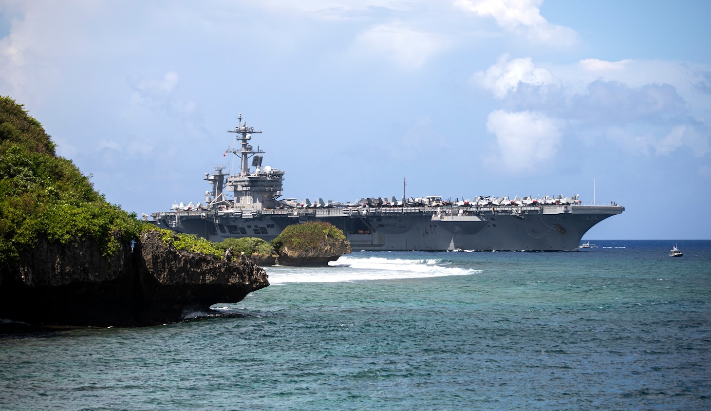 APRA HARBOR, Guam (Nov. 11, 2021) – The Nimitz-class aircraft carrier USS Carl Vinson (CVN 70) arrives at Guam for a port visit. The arrival of Carl Vinson Carrier Strike Group marks the first time that a carrier strike group with the advanced capabilities of the F-35C Lightning II and Navy CMV-22B Osprey have visited Guam. Carl Vinson Strike Group is on a scheduled deployment in the U.S. 7th Fleet area of operations to enhance interoperability through alliances and partnerships while serving as a ready response force in support of a free and open Indo-Pacific region. (U.S. Navy photo by Mass Communication Specialist 1st Class Devin M. Langer)
