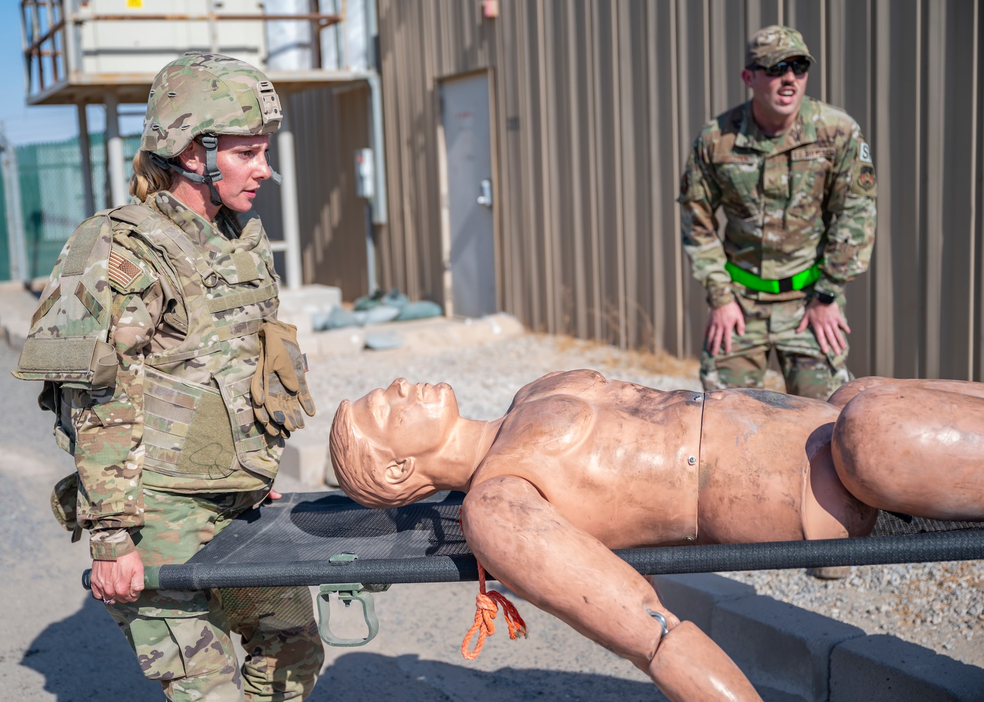 Tech. Sgt. Chelsea Munoz, assigned to the 407th Expeditionary Support Squadron, carries a training dummy during Tactical Combat Casualty Care training at Al Jaber Air Base, Kuwait, Nov. 5, 2021.