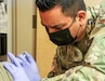 Kentucky Army National Guard Sgt. Roberto Gorostieta, a combat medic with the 130th Engineer Support Company and vaccination team non-commissioned officer, administers COVID-19 vaccination at the Boone National Guard Center, in Frankfort, Ky., November 6, 2021