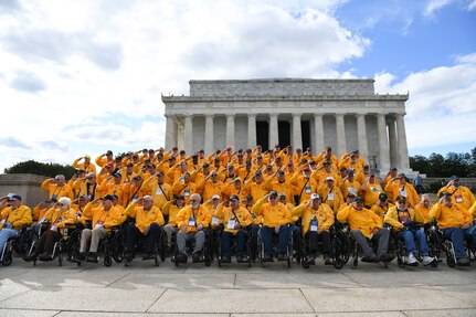 Veterans from Illinois and Iowa salute for a photo at the Lincoln Memorial in Washington D.C., Nov. 4, 2021. These veterans visited Arlington National Cemetery, the Lincoln Memorial, Vietnam Veterans Memorial, Korean War Veterans Memorial and World War II Memorial as part of a tour of the nation's capital.