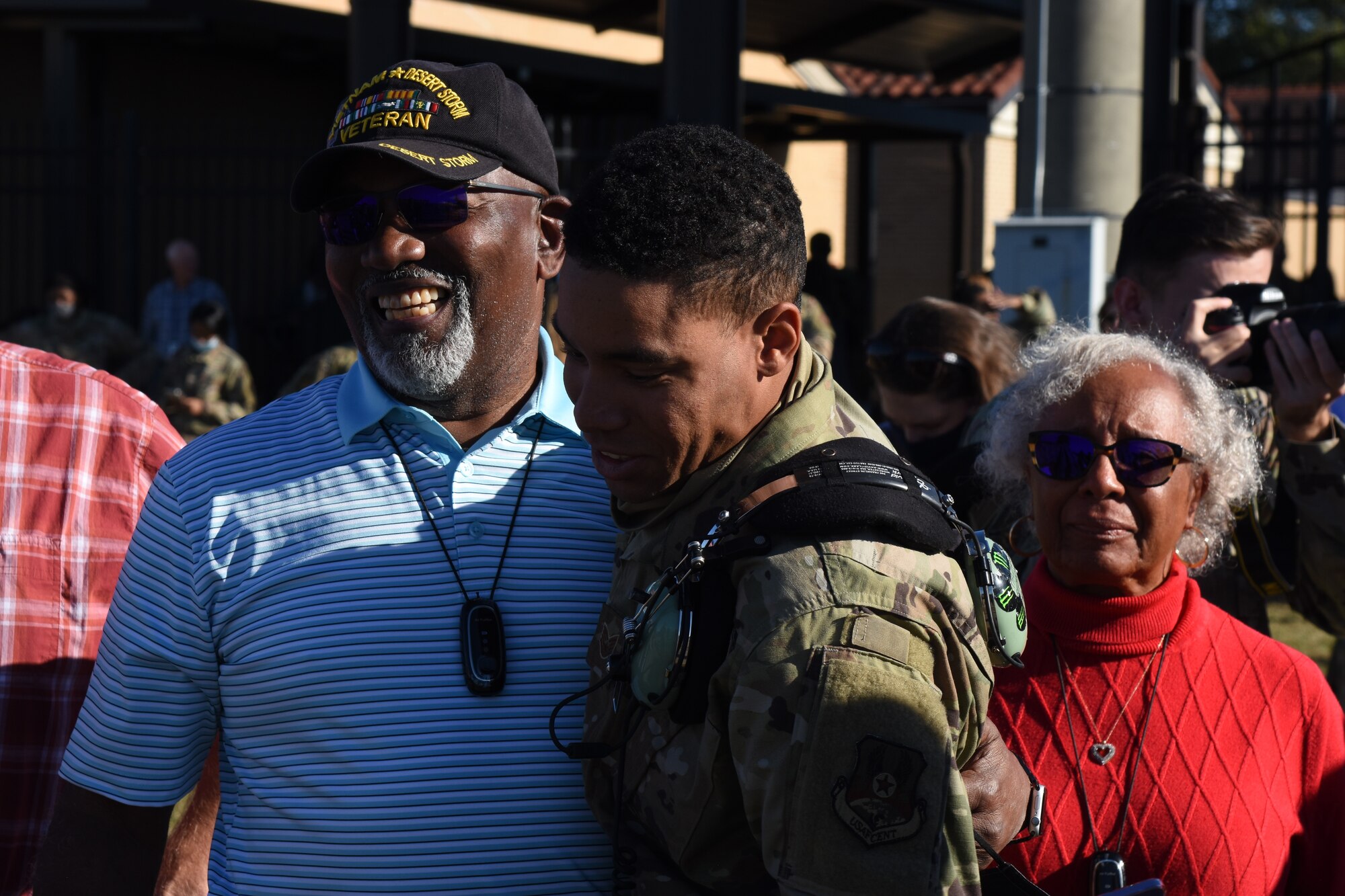 Staff Sgt. Christopher Redmond, 908th Aircraft Maintenance Squadron, greets his family here Monday, 8 November, after returning from a four-month deployment to Southwest Asia.  Redmond was one of nearly 300 908th Airlift Wing Airmen who executed the largest deployment in wing history over the spring and summer of 2021.