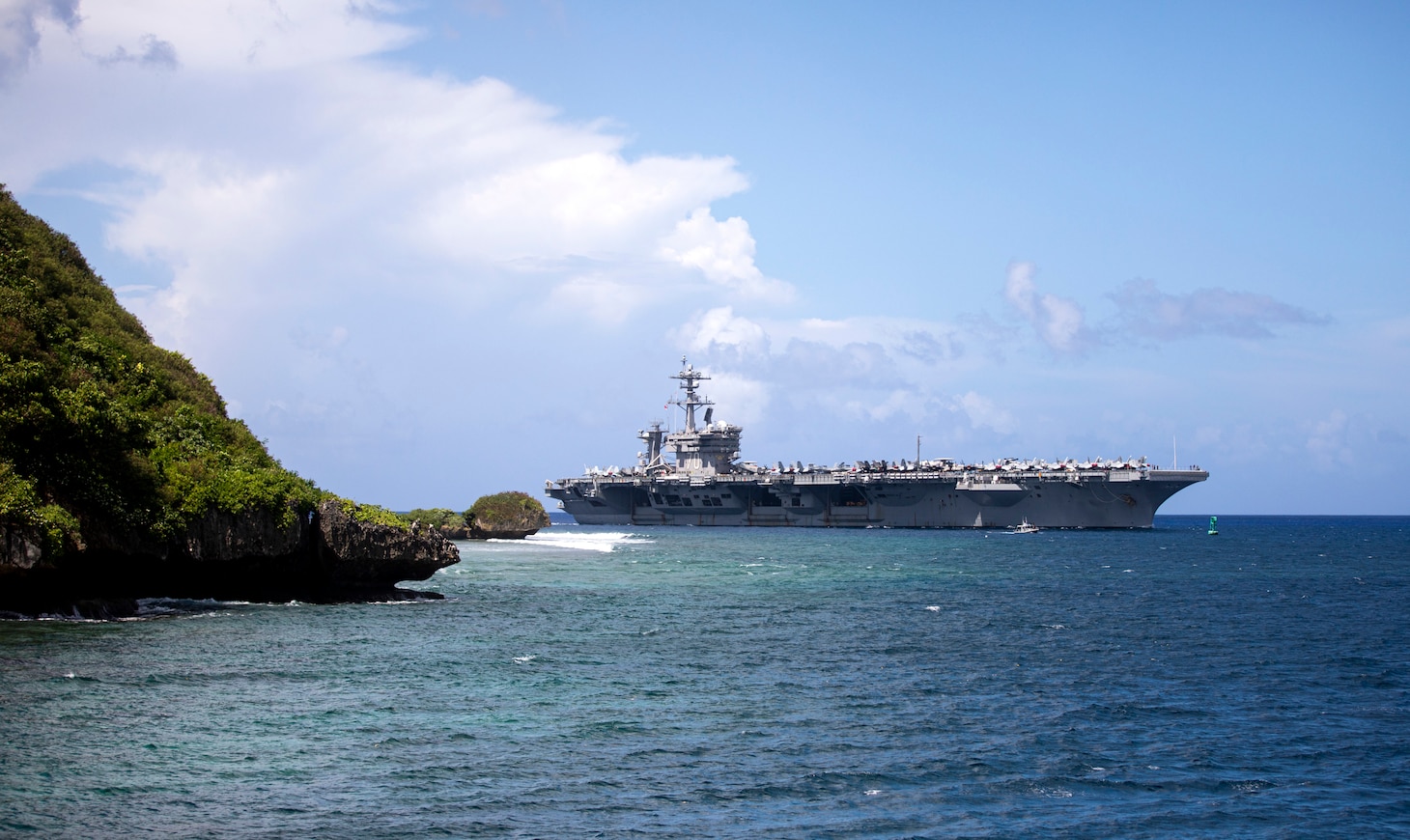 APRA HARBOR, Guam (Nov. 11, 2021) – The Nimitz-class aircraft carrier USS Carl Vinson (CVN 70) arrives at Guam for a port visit. The arrival of Carl Vinson Carrier Strike Group marks the first time that a carrier strike group with the advanced capabilities of the F-35C Lightning II and Navy CMV-22B Osprey have visited Guam. Carl Vinson Strike Group is on a scheduled deployment in the U.S. 7th Fleet area of operations to enhance interoperability through alliances and partnerships while serving as a ready response force in support of a free and open Indo-Pacific region. (U.S. Navy photo by Mass Communication Specialist 1st Class Devin M. Langer)