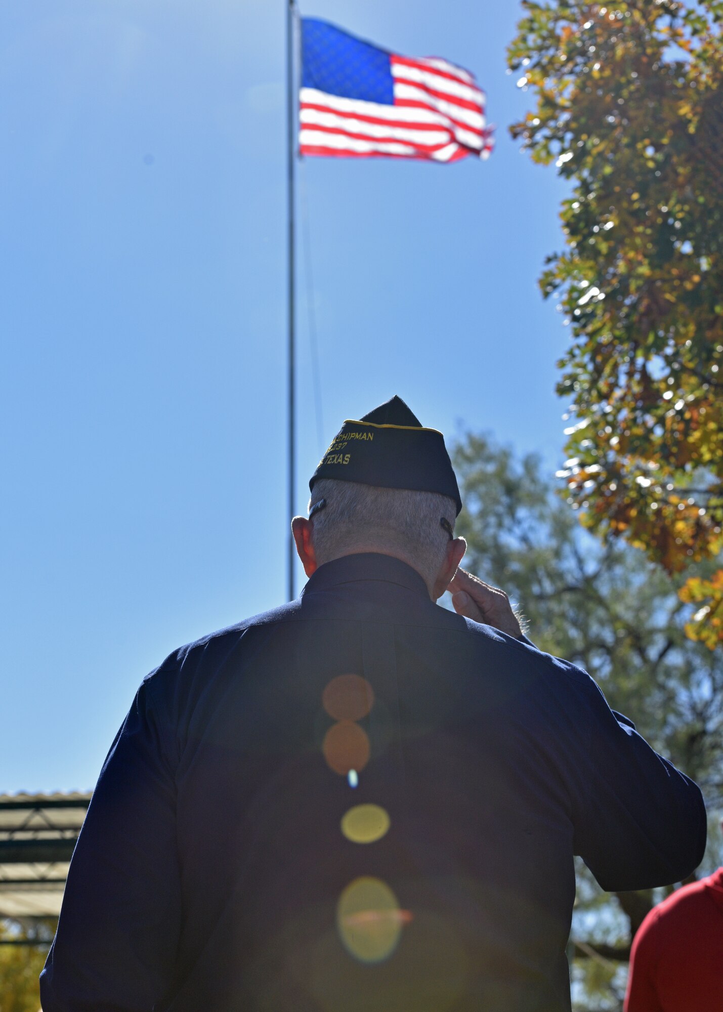 A local Veteran salutes during the playing of ‘Taps’ during the Veterans Day ceremony at the Fairmount Cemetery in San Angelo, Texas, Nov. 11. Veterans Day celebrates all those who served in service of their nation. (U.S. Air Force photo by Senior Airman Ashley Thrash)