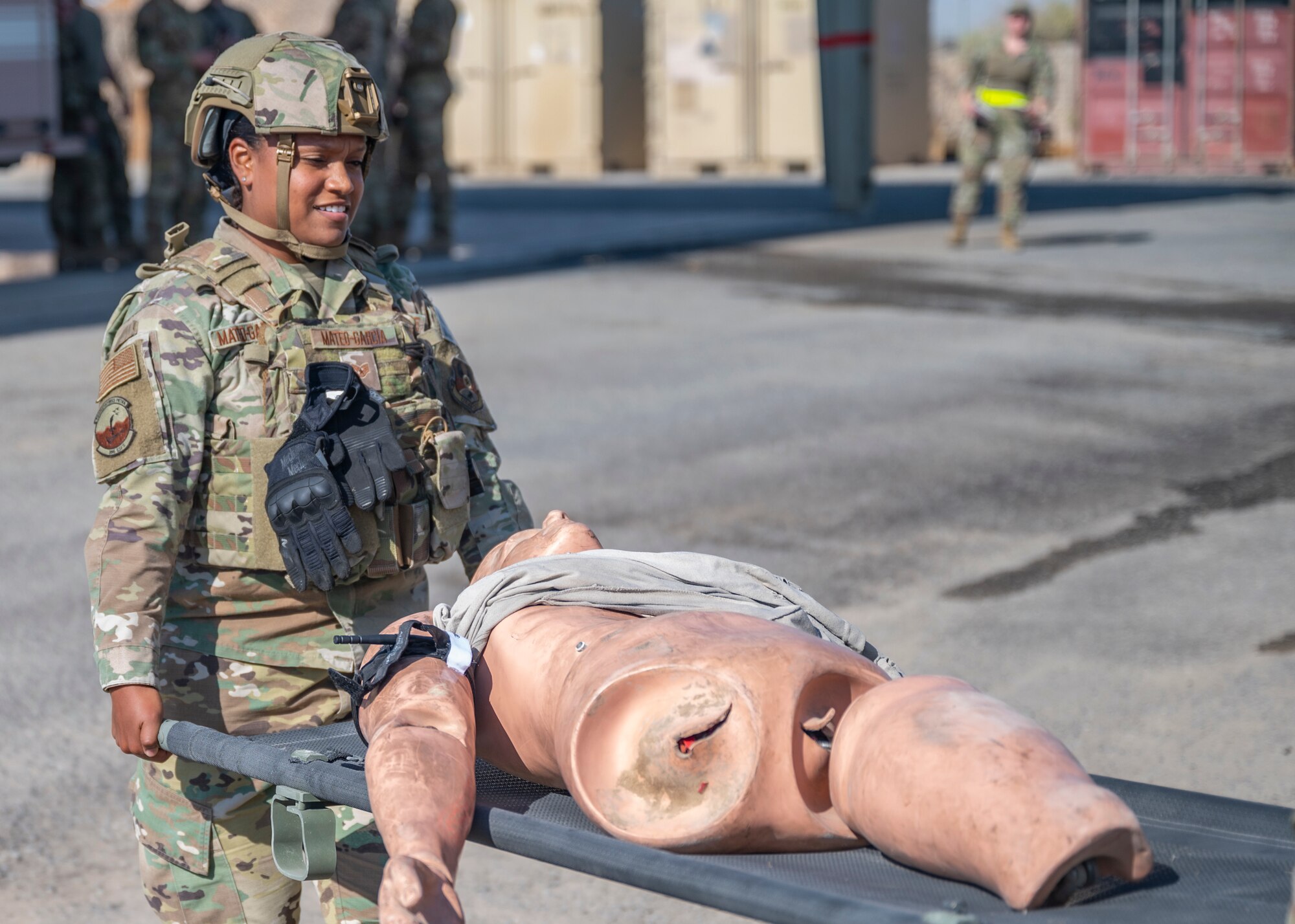 Staff Sgt. Edmaris Mateo-Garcia, assigned to the 386th Expeditionary Security Forces Squadron, carries a training dummy during Tactical Combat Casualty Care training at Al Jaber Air Base, Kuwait, Nov. 5, 2021.