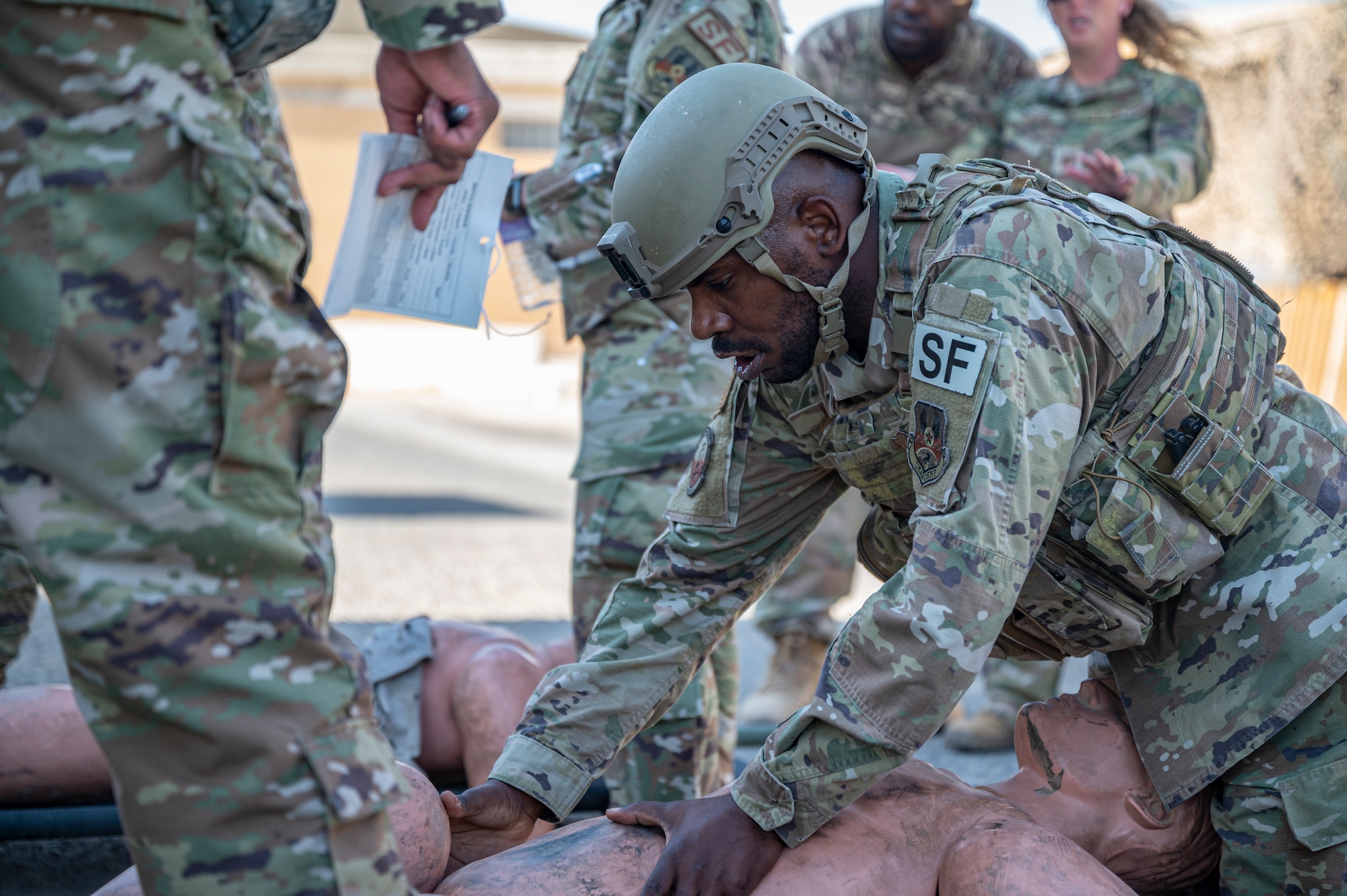 Tech. Sgt. Brandon Kelly, assigned to the 386th Expeditionary Security Forces Squadron, provides medical aid to a training dummy during Tactical Combat Casualty Care training at Al Jaber Air Base, Kuwait, Nov. 5, 2021.