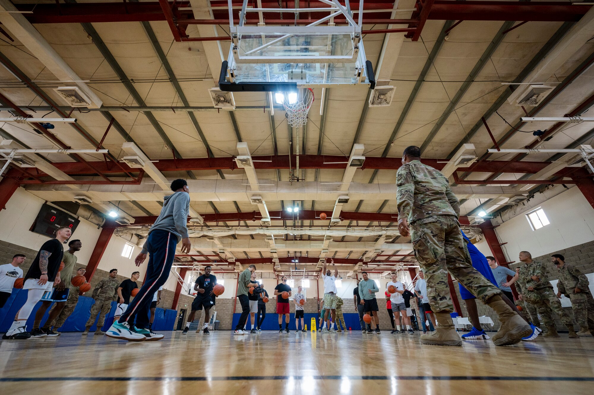 Tracy McGrady and Jalen Rose play basketball with service members Nov. 11, 2021 at Al Udeid Air Base, Qatar.