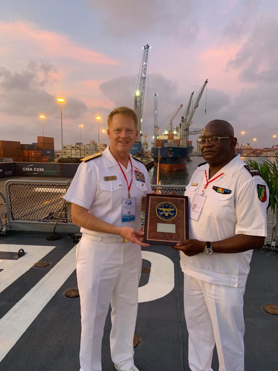 (Nov. 9, 2021) Rear Adm. Benjamin Reynolds, U.S. Naval Forces Europe-Africa/U.S. Sixth Fleet Director of Maritime Headquarters, presents Capt. Rene Nganongo, Head of Republic of Congo Navy, a token of appreciation, Nov. 9, 2021. U.S. Sixth Fleet, headquartered in Naples, Italy, conducts the full spectrum of joint and naval operations, often in concert with allied and interagency partners, in order to advance U.S. national interests and security and stability in Europe and Africa.