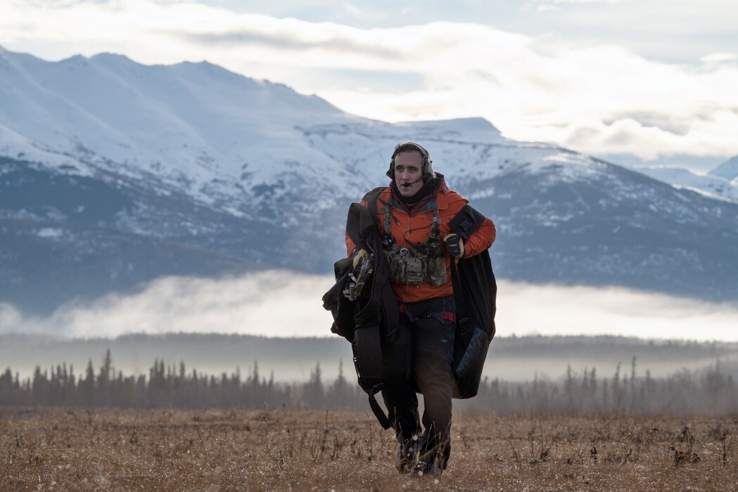 A pararescueman returns after a successful jump.