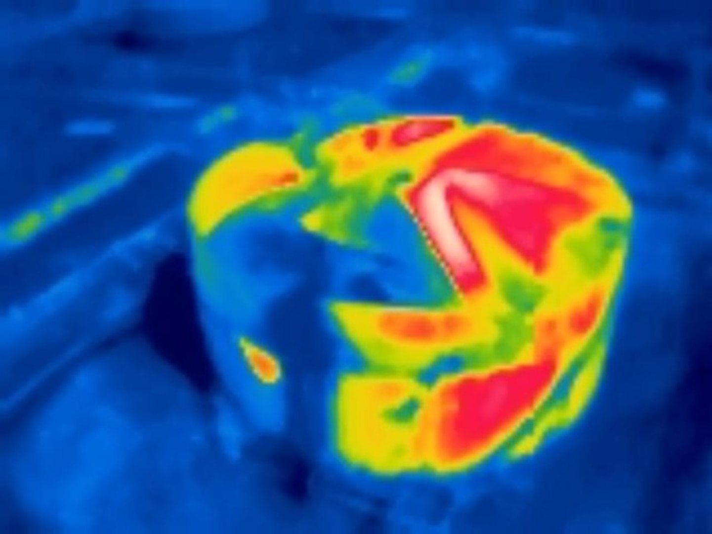 The Coast Guard UAS Team used a drone to take this infrared image of the Chevron oil storage tank that caught fire in Pasadena, Texas, Aug. 18, 2020. It was used to determine if the fire was out or there was a risk of re-flash. The red areas indicate where residual heat in the remaining oil and surrounding steel is most intense. U.S. Coast Guard photo by Chief Petty Officer Cameron Steinmetz and Petty Officer 3rd Class Tim Loveday.