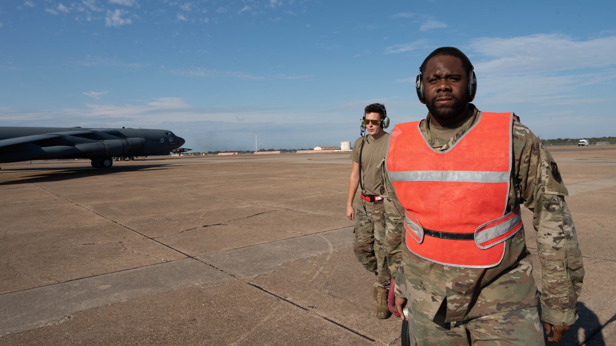 Senior Airman Joe Dorsey and Airman 1st Class Noah Maurer, both 2nd Aircraft Maintenance Squadron crew chiefs, haul equipment off the flightline after completing pre-flight checks on a B-52 Stratofortress during Global Thunder 22 at Barksdale Air Force Base, Louisiana, Nov. 2, 2021.