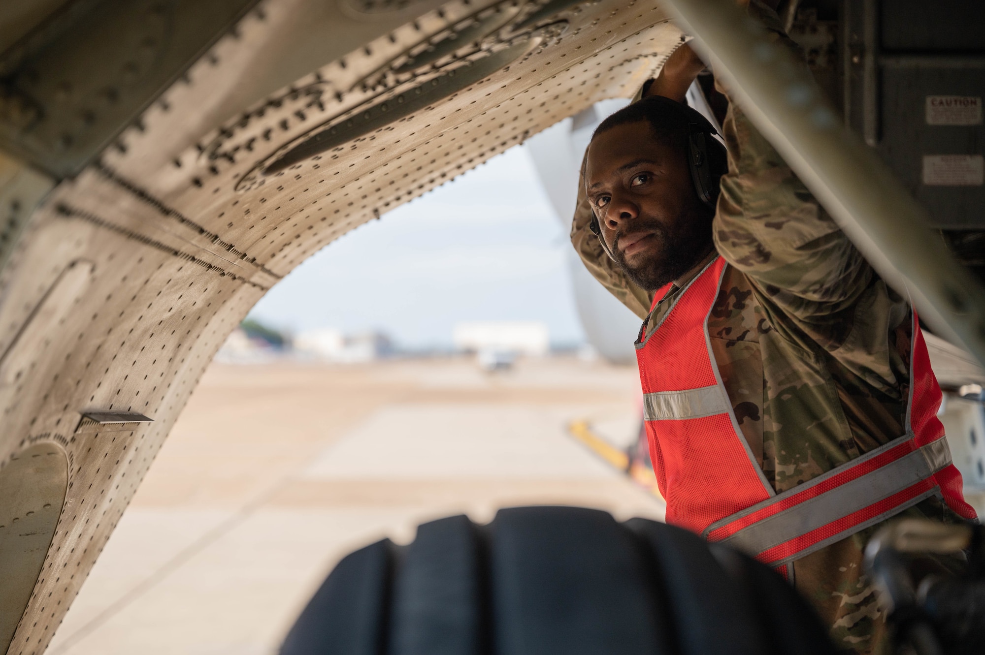 Senior Airman Joe Dorsey, 2nd Aircraft Maintenance Squadron crew chief, waits for confirmation while completing a pre-flight check on a B-52 Stratofortress during Global Thunder 22 at  Barksdale Air Force Base, Louisiana, Nov. 2, 2021.