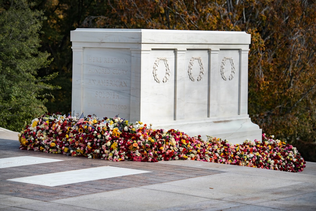 Flowers surround the base of the Tomb of the Unknown Soldier.