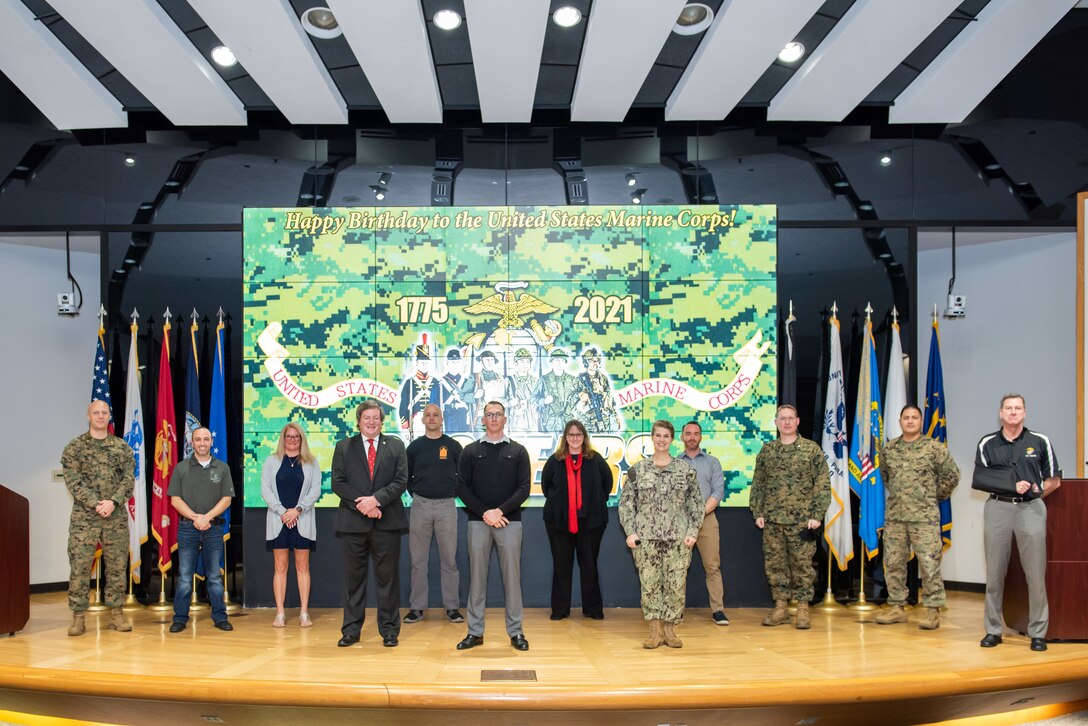 A group of former and present Marines on stage.