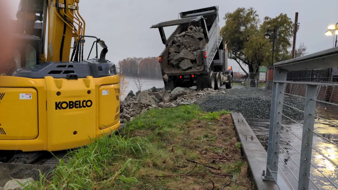Solo truck used to stabilize a damaged levee and place rock armor along the left bank of the Skagit River, Washington.