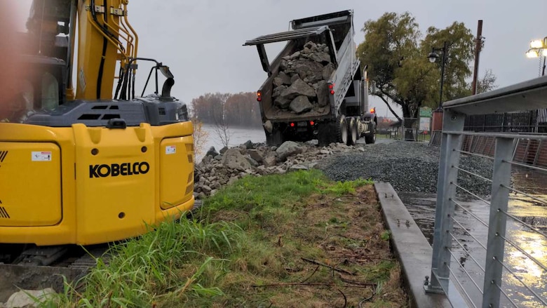 Solo truck used to stabilize a damaged levee and place rock armor along the left bank of the Skagit River, Washington.