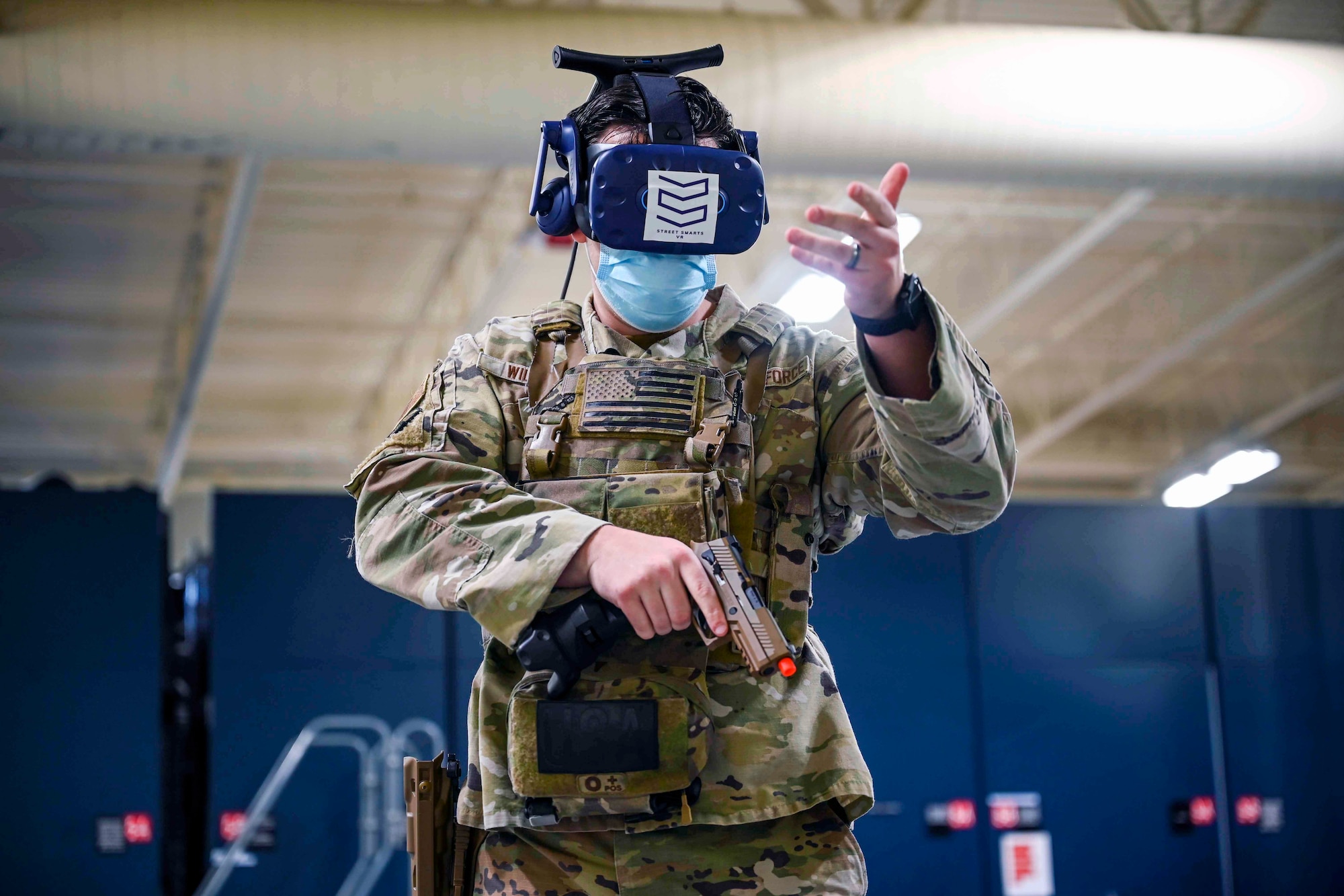 A Airman simulates de-escalating an armed person while using Virtual Reality.
