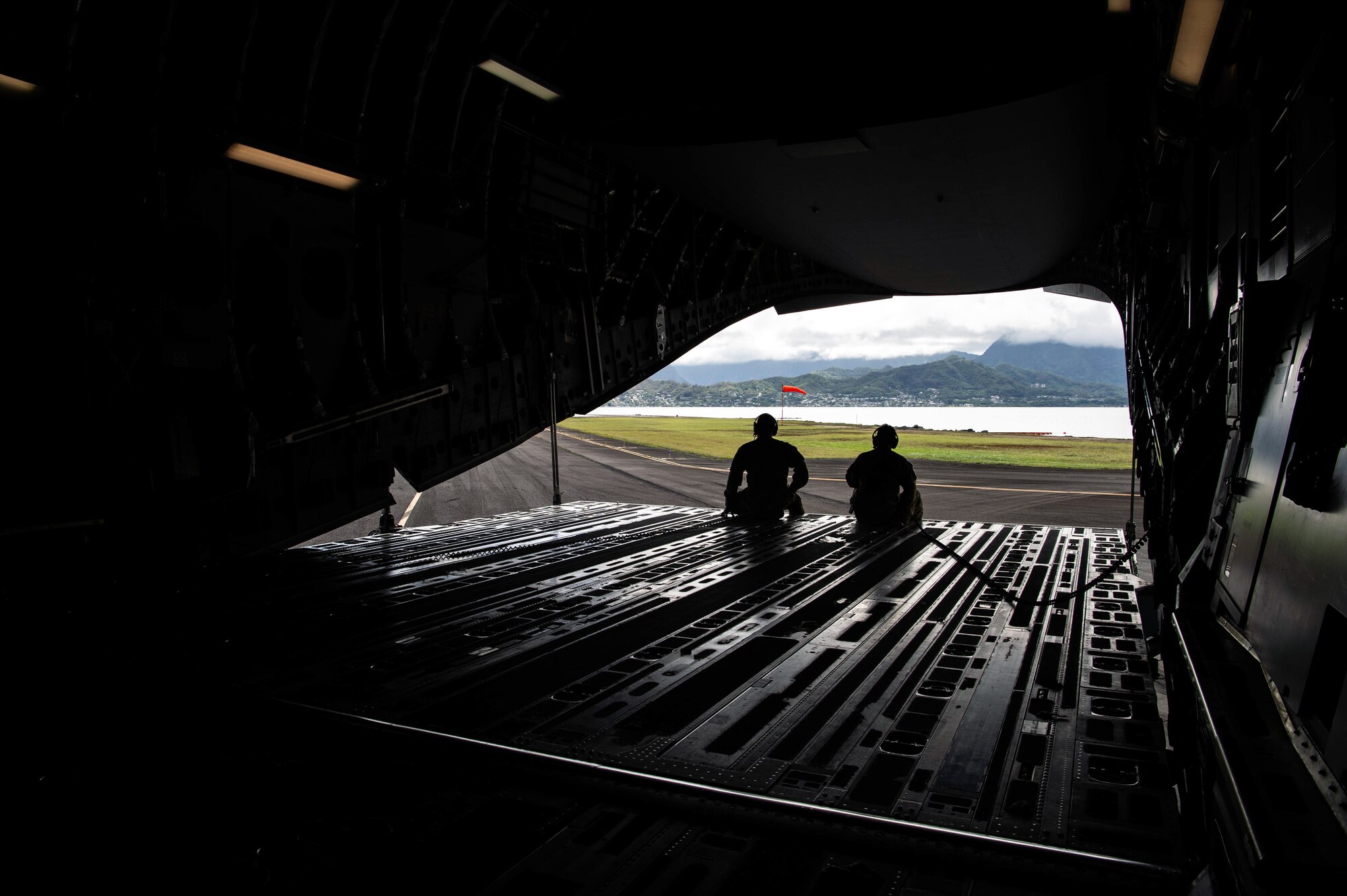 Airmen call out instructions over the intercom during training aboard a C-17 Globemaster III.