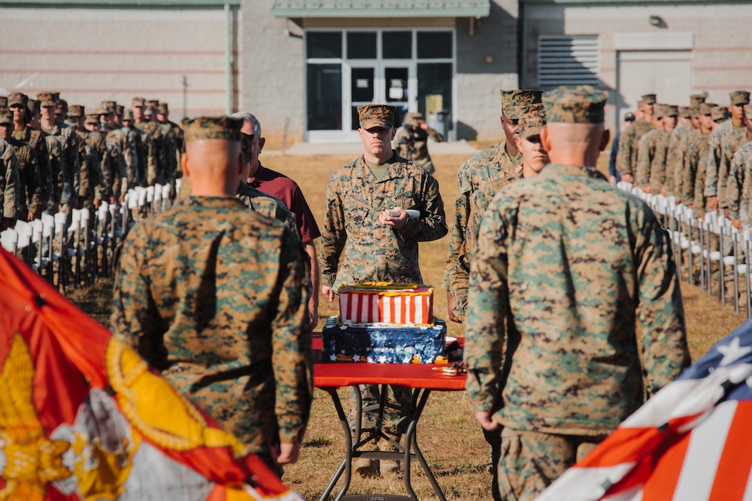 U.S. Marine Corps Capt. Sean W. Andrascik, an adjutant with the 26th Marine Expeditionary Unit, prepares to recite Gen. John A. Lejeune's Marine Corps birthday message during a cake-cutting ceremony to celebrate the 246th Marine Corps birthday on Fort Pickett, Virginia, Nov. 10, 2021.